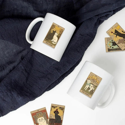 Two white mugs with tarot card design stitclers