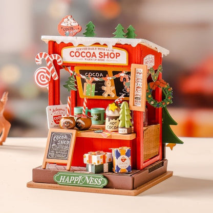 image displaying the assembled Christmas Cocoa Shop DIY Miniature House Kit on table