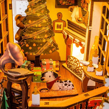 image displaying miniature scene of a finished Christmas House DIY Book Nook Kit