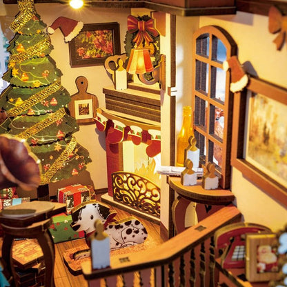 image displaying miniature scene of a finished Christmas House DIY Book Nook Kit