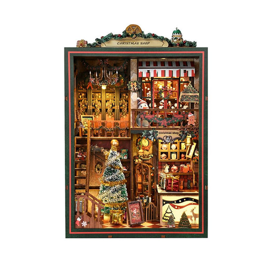 Decorative Christmas shop miniature model with various items and a tree inside a book nook