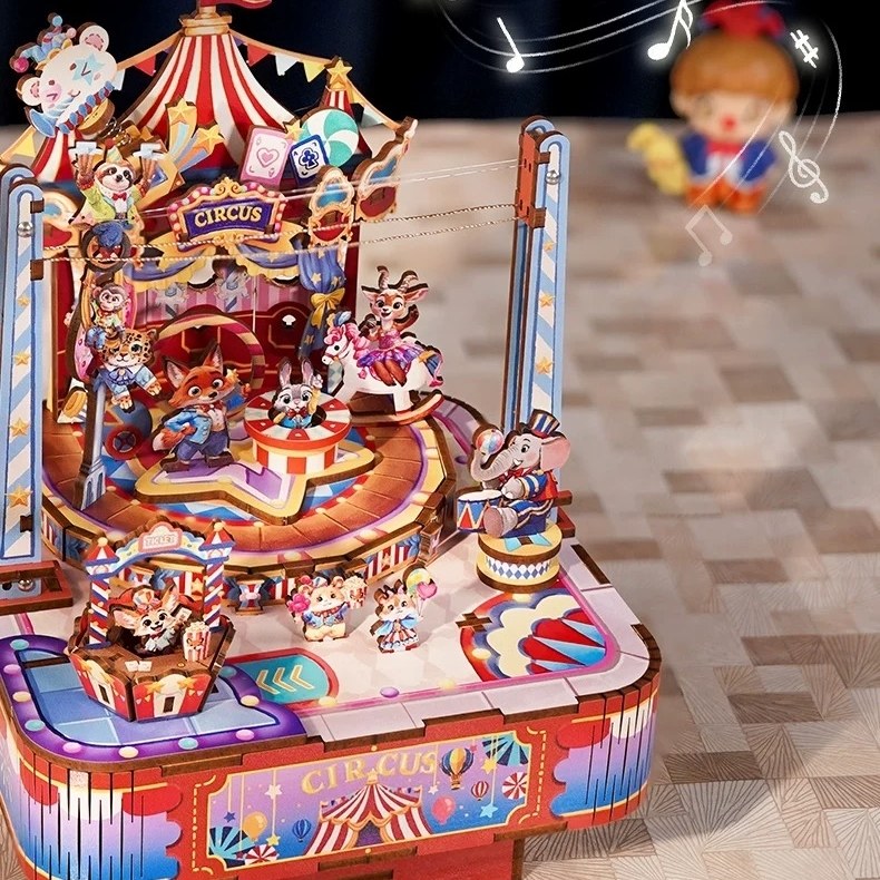 Colorful circus-themed wooden model set with animated characters on a checkered floor.