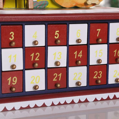 Christmas Countdown Wooden Advent Calendar featuring Santa climbing up a ladder alongside a decorated Christmas tree, 24 drawers on the base