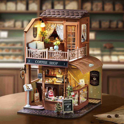 Miniature House of a coffee shop with detailed interior and 'Coffee Shop' sign on table as a home decor piece