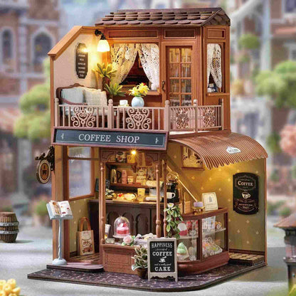 dollhouse of a coffee shop with detailed interior and exterior, set against a blurred street background.
