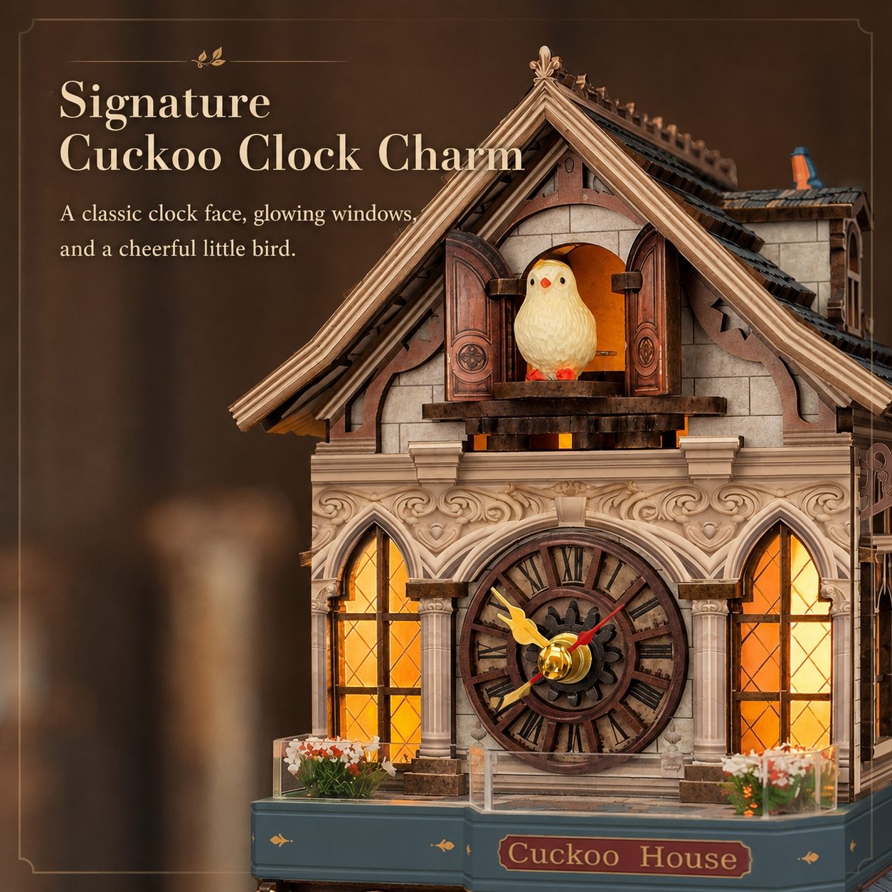 A decorative cuckoo clock house charm with a warm glowing clock face, illuminated window panes, a small bird figure on the roof, and the words 'Signature Cuckoo Clock Charm' and 'Cuckoo House' in the image design.
