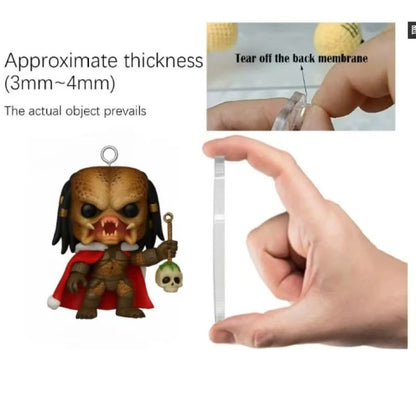 Hand holding a acrylic piece next to a small figurine, with text about thickness.