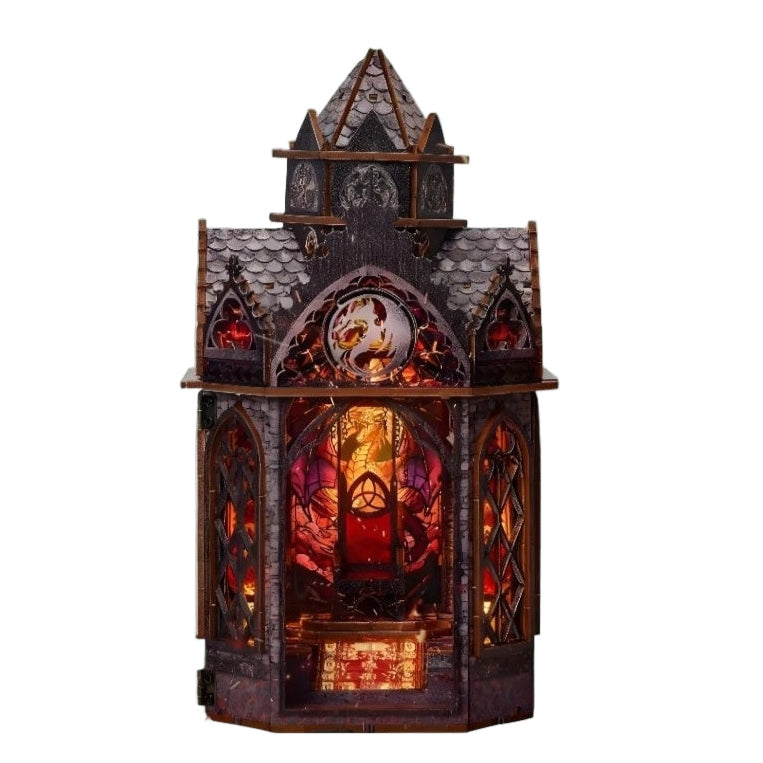 Gothic-style dragon tower miniature house with intricate design and warm lighting