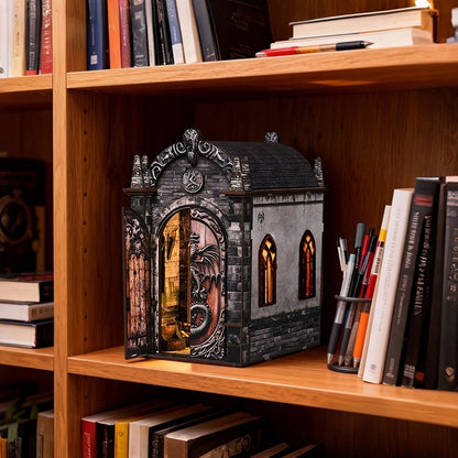 wooden bookend shaped like a dragon castle on a wooden shelf with books and pens.