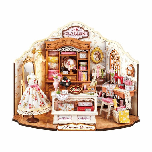 Sewing Room Diorama Dollhouse with miniature furniture and accessories on a white background