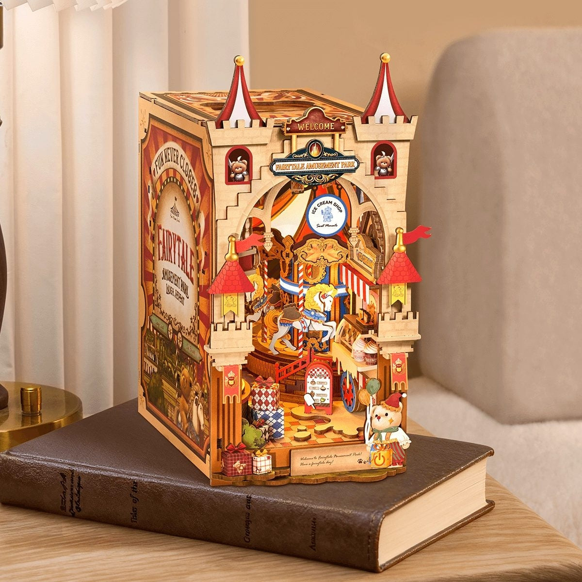 Decorative wooden book nook model of a carousel on top of a book