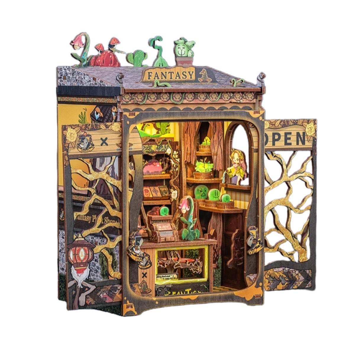 Fantasy Plant Shop DIY Book Nook Kit, a mystical miniature shop filled with magical plants, complete with a touch-activated light and protective dust cover. Perfect for any book lover’s collection. Perfect for those who love the whimsical world, DIY enthusiasts, bookend lovers, model building lovers, dollhouse collectors, bookshelf insert decor.