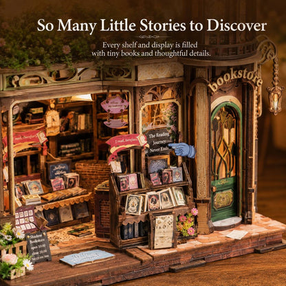 A miniature diorama model of a vintage bookshop storefront with tiny books, shelves, a green door, hanging lanterns, and decorative signs. Text at the top reads 'So Many Little Stories to Discover' with additional descriptive copy.