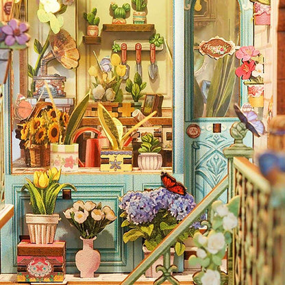 Colorful indoor garden scene with plants, flowers, and gardening tools.
