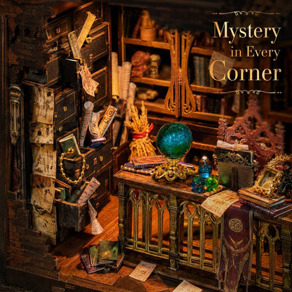 Miniature room setup with books, a globe, and other objects with 'Mystery in Every Corner' text.