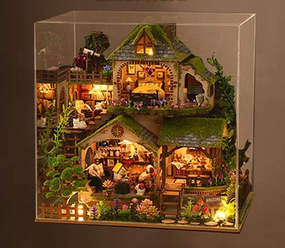 image displaying a assembled Forest Adventure DIY Miniature House Kit in a acrylic dust cover box