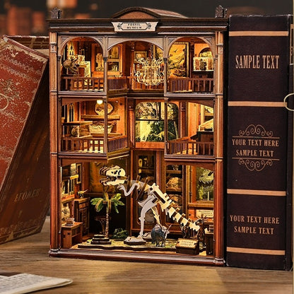 Wooden book nook model in a bookshelf with various items inside, resembling a miniature museum.