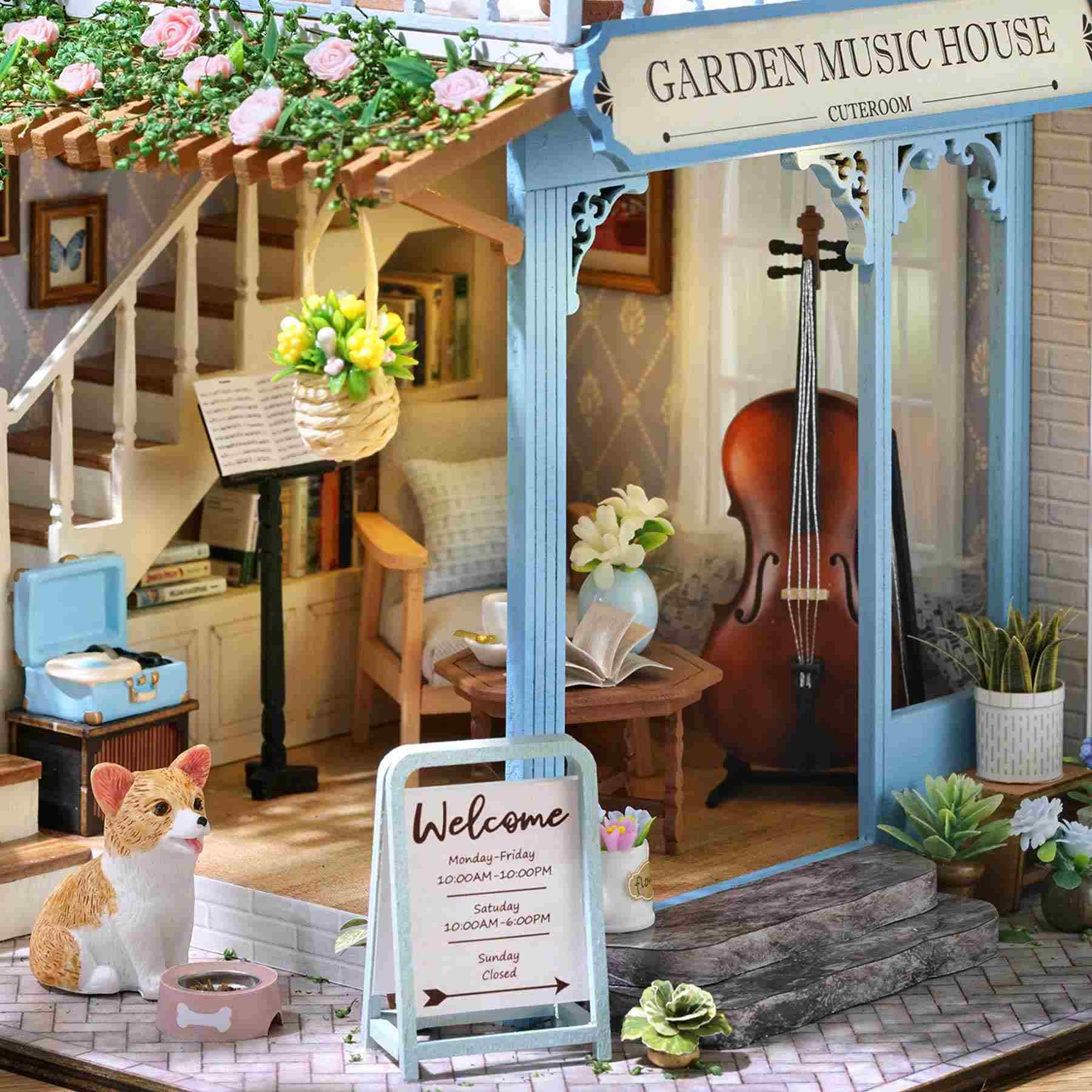 close up the 1st floor Miniature scene of a 'Garden Music House' with a welcome sign, staircase, and musical instruments.