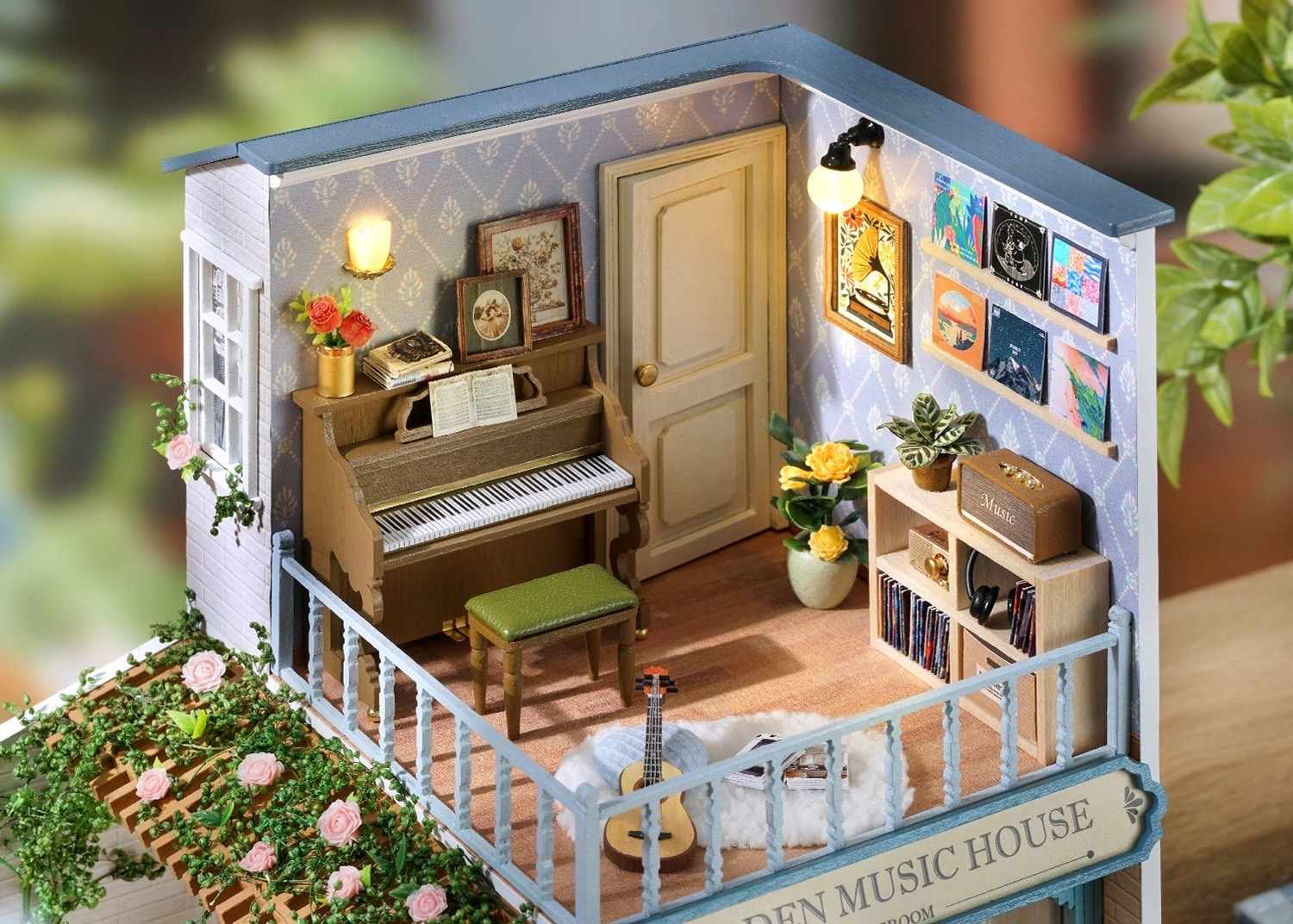close up the second floor Miniature scene of a music-themed room with a piano, books, and decorative items.