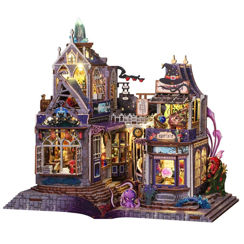 Detailed miniature house model of a huanted magic house with various elements on a white background