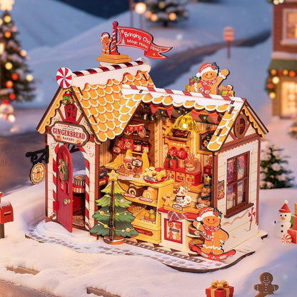 Gingerbread house model with decorative elements on a snowy background