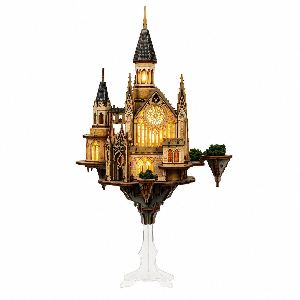 A detailed gothic castle miniature puzzle model on a clear acrylic stand, featuring warm yellow illuminated windows and dark gray roofs, set against a plain white background.