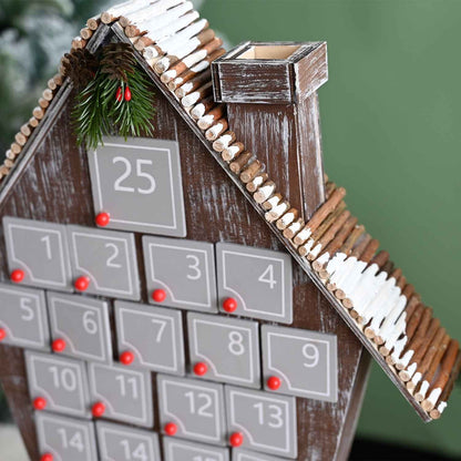 close-up of hand-painting details of the24 Days Hand-painted Grey Cottage-shaped Wooden Christmas Advent Calendar