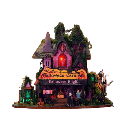assembled Halloween miniature house with illuminated lights on a white background