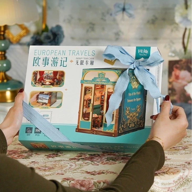 image showcasing package of Infinity Train Cabin DIY Book Nook Kit