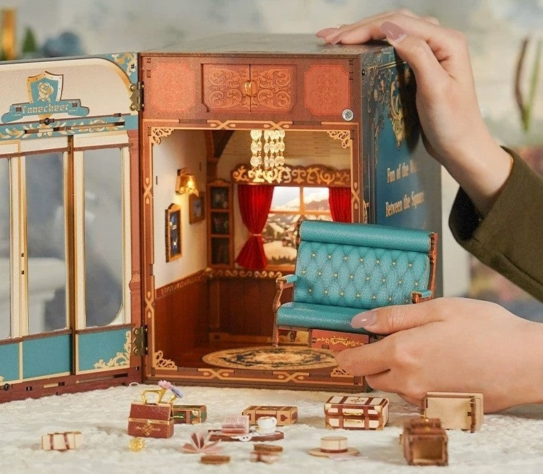image showcasing the miniature furniture put into Infinity Train Cabin DIY Book Nook Kit