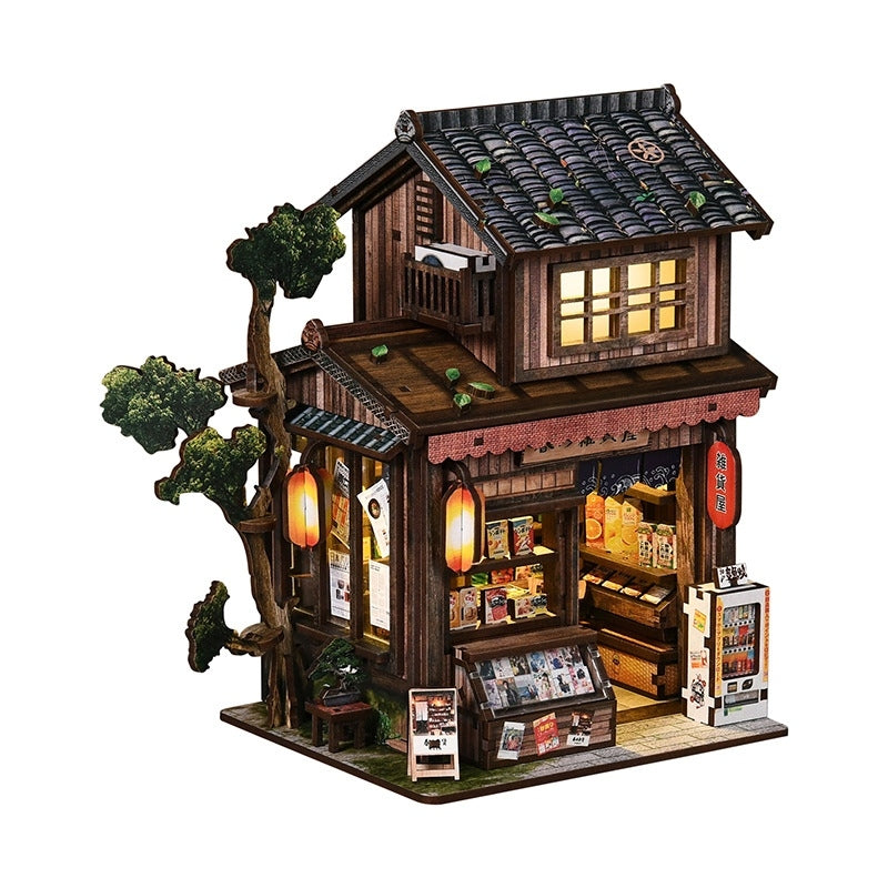Miniature Model of a wooden Japanese grocery store with a tree, lights, and shelves on a white background