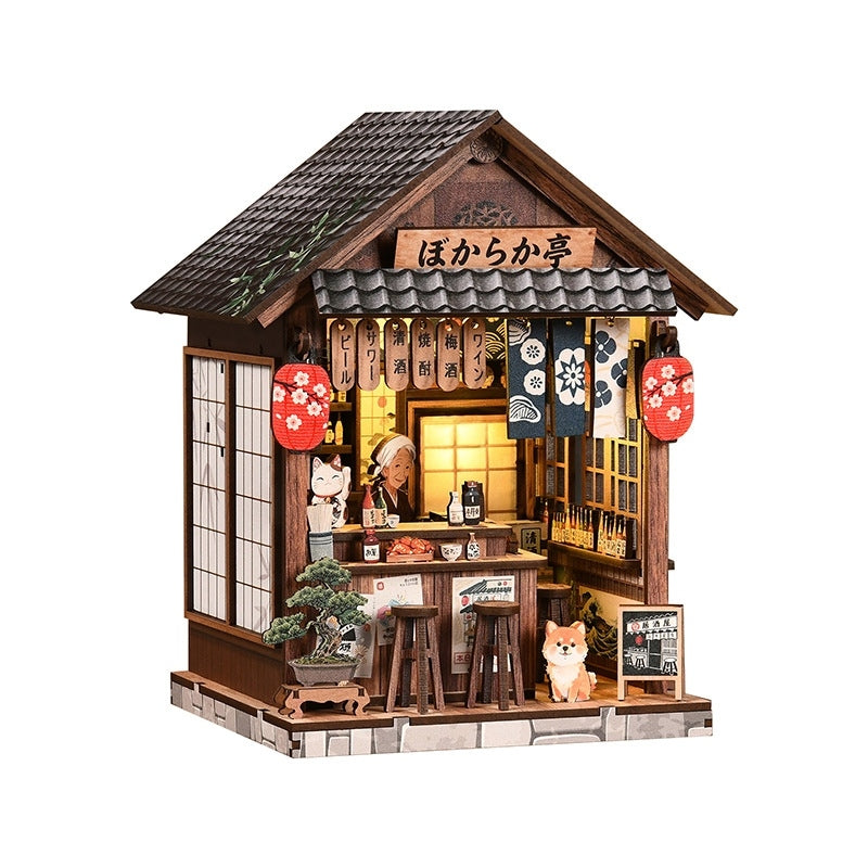 book nook Model of a Japanese restaurant with wooden architecture and decorative elements on a white background