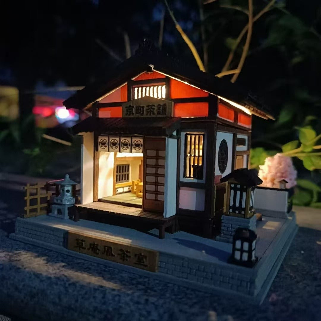 image displaying the assembled and painted Japanese Tea House DIY Miniature Dollhouse Kit with light on