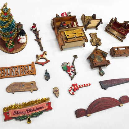 image showing miniature parts of the Jingle Cabin Book Nook Kit