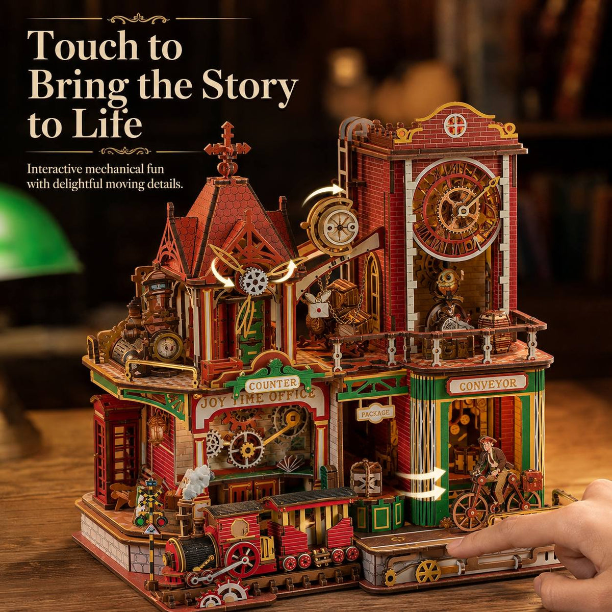 A detailed steampunk-style wooden model building with gears, clocks, a train, and a bicycle, shown on a wooden surface with a finger touching it. Text on the image reads 'Touch to Bring the Story to Life' and 'Interactive mechanical fun with delightful moving details.