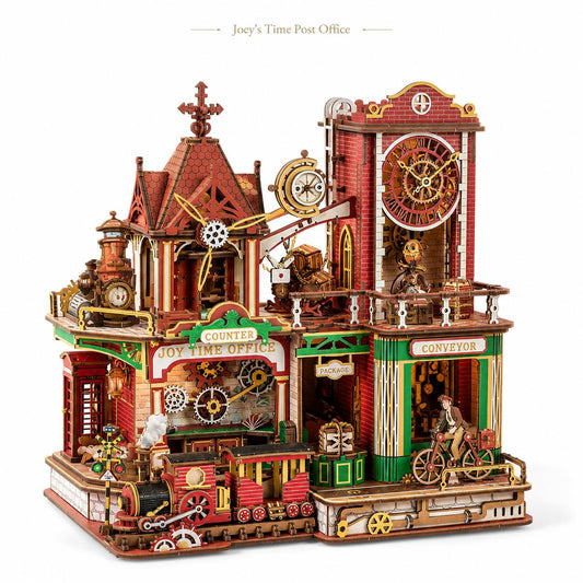 A detailed 3D wooden model of a Victorian-style Joy Time Post Office and Train Depot, featuring intricate gears, clocks, a train, and a bicycle, shown on a plain white background with the text 'Joey's Time Post Office' above it.