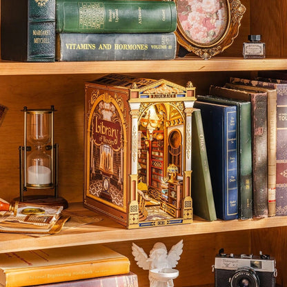 Decorative book nook with vintage library setting and a decorative box on a wooden shelf.