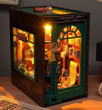 image displaying the finished Magic Diary DIY Book Nook Kit with warm LED light in a table setting