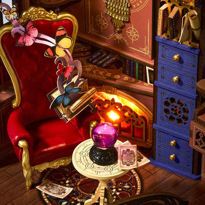 miniature scene with a red chair, blue cabinet, and mystical elements in a magic house book nook
