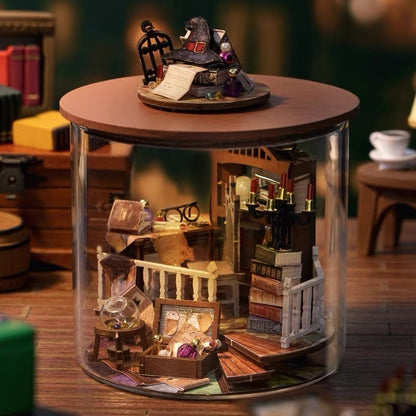 image displaying an assembled Magic House DIY Miniature House Kit in Dream Bottle Series in a vintage study room themed table setting