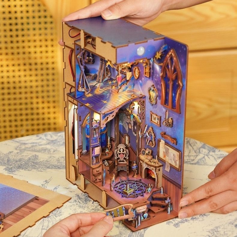 Wooden puzzle of Wizarding World theme with intricate design assembling by hands