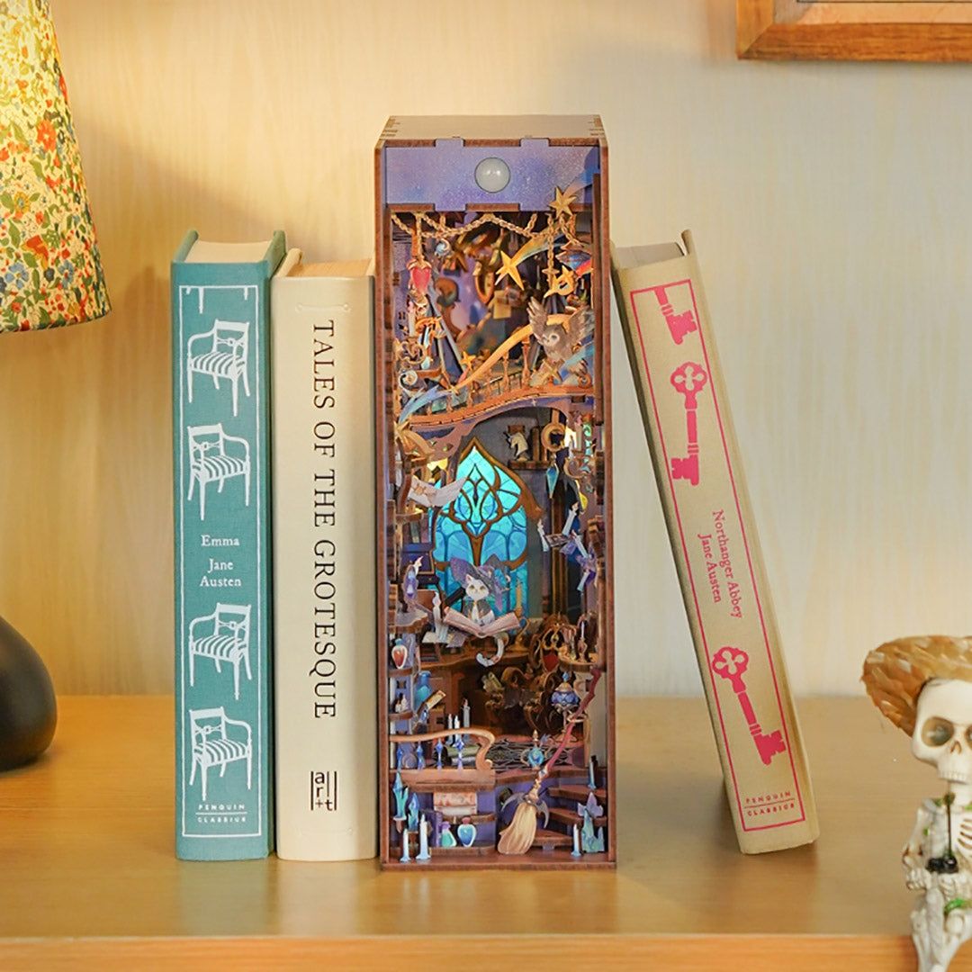 Decorative wooden Magic Stars Room book nook with intricate design resembling a bookshelf, surrounded by books