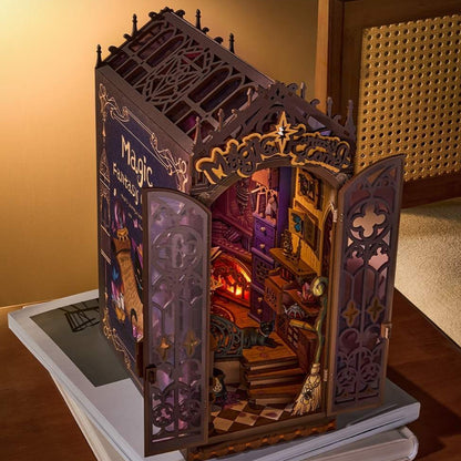Detailed model of a magical house with open pages revealing a miniature world.