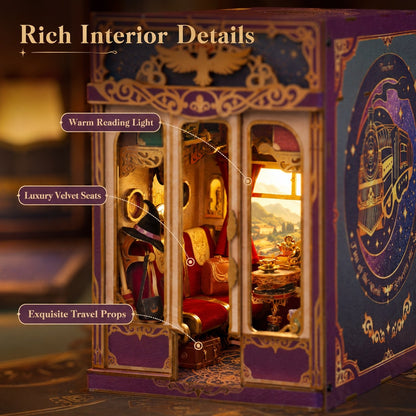 A decorative miniature travel-themed book nook with illustrated purple and gold exterior panels and a warm lit interior showing red velvet seats, a reading nook, and travel props. Text callouts highlight warm reading light, luxury velvet seats, and exquisite travel props.