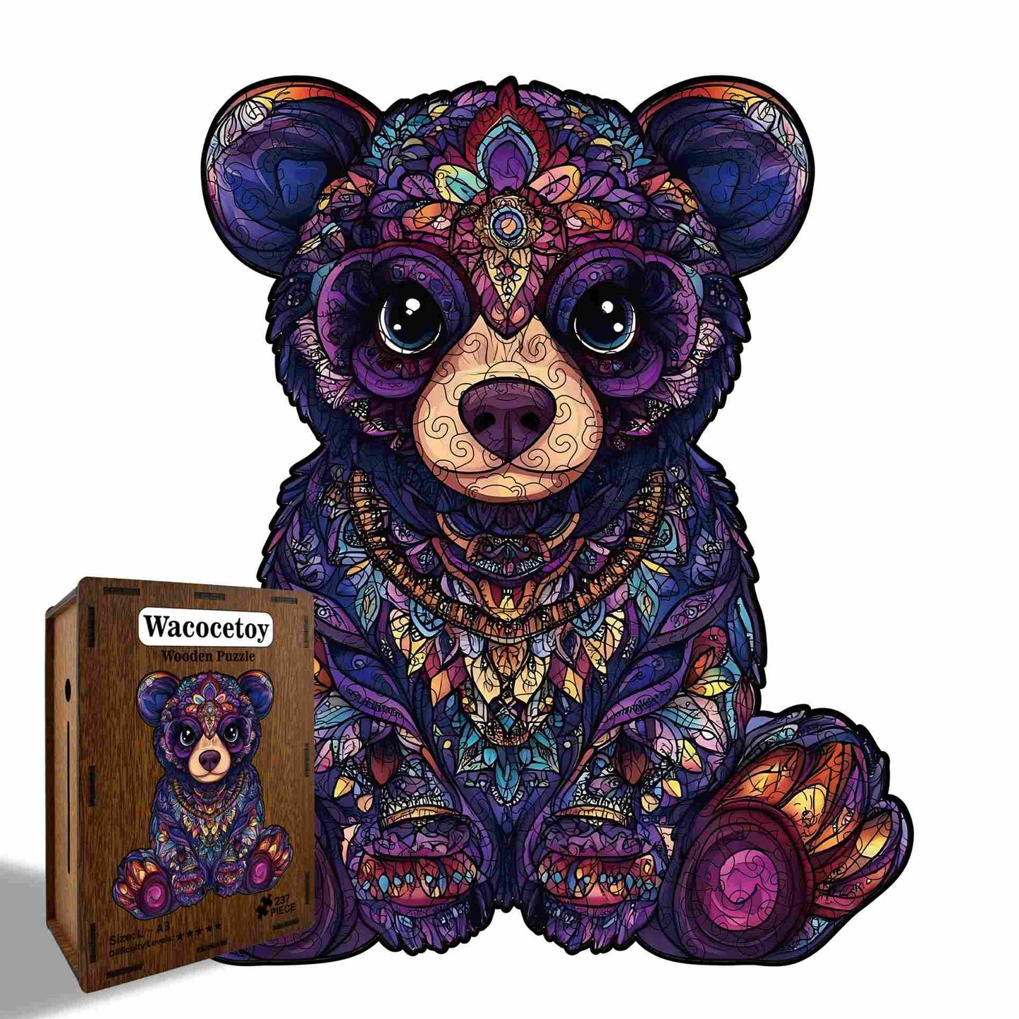 Colorful teddy bear puzzle with intricate patterns next to its packaging on a white background