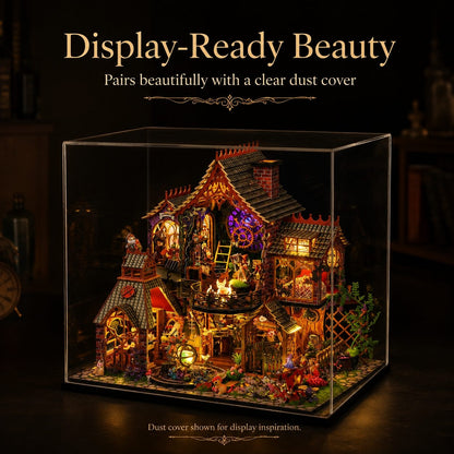 A miniature fantasy house display inside a clear acrylic dust cover, illuminated with warm LED lights. The scene includes tiny figures, plants, and decorative details, with text above reading 'Display-Ready Beauty' and text below noting the dust cover shown for display inspiration.