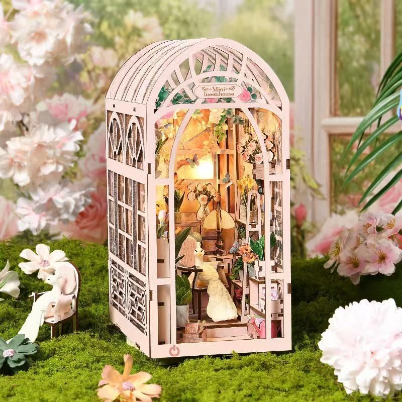 image displaying finished Mini Greenhouse DIY Book Nook Kit in a botanic setting