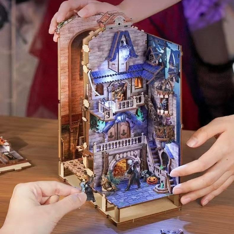 Detailed miniature model of a fantasy scene with people interacting with it 