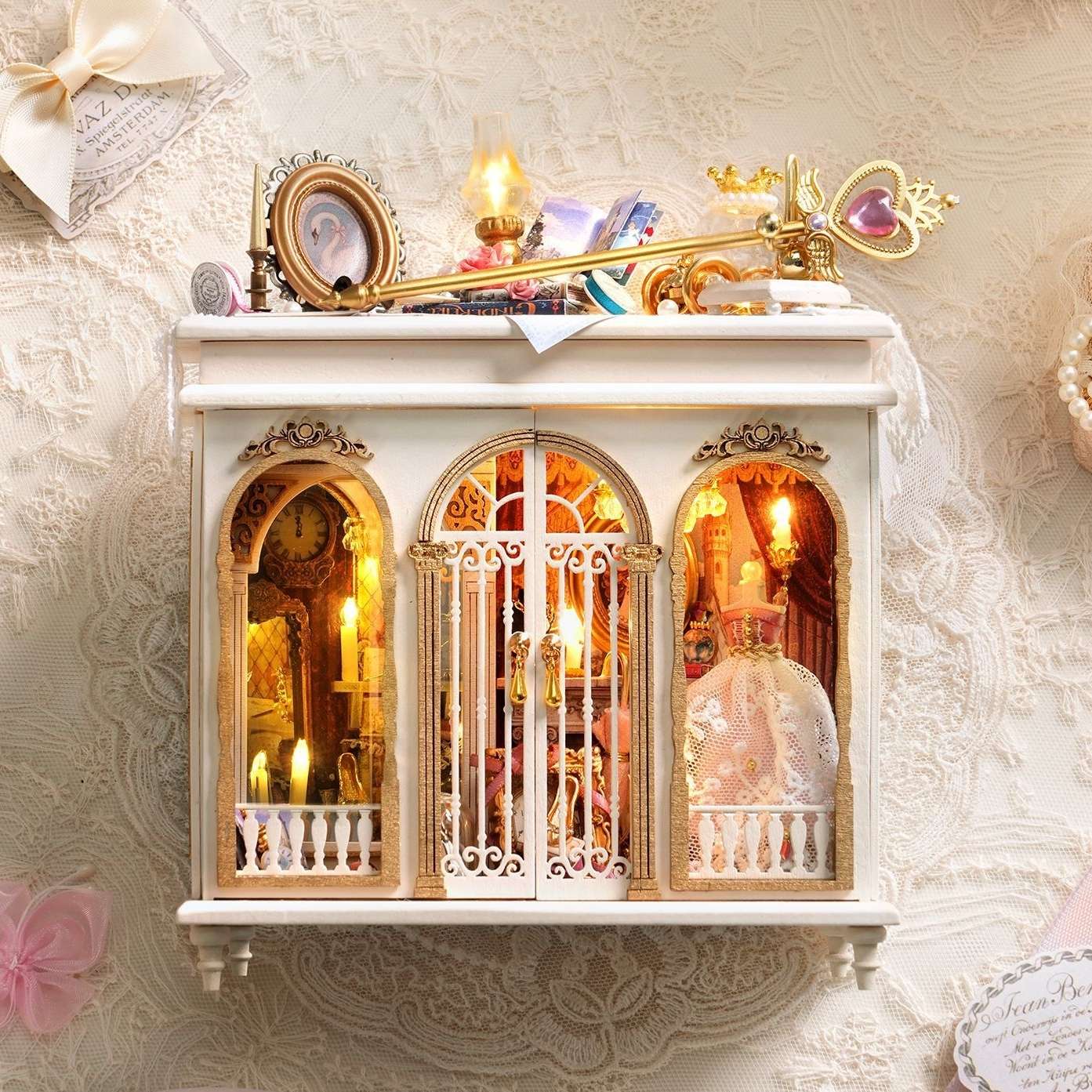 fantasy DIY miniature house with ornate decorations on a textured wall