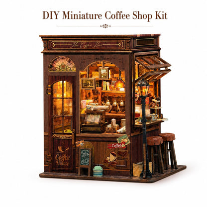 DIY miniature coffee shop kit with a detailed wooden storefront, warm glowing interior lights, shelves with coffee accessories, two stools, and a street lamp, shown on a white background with 'DIY Miniature Coffee Shop Kit' text above.